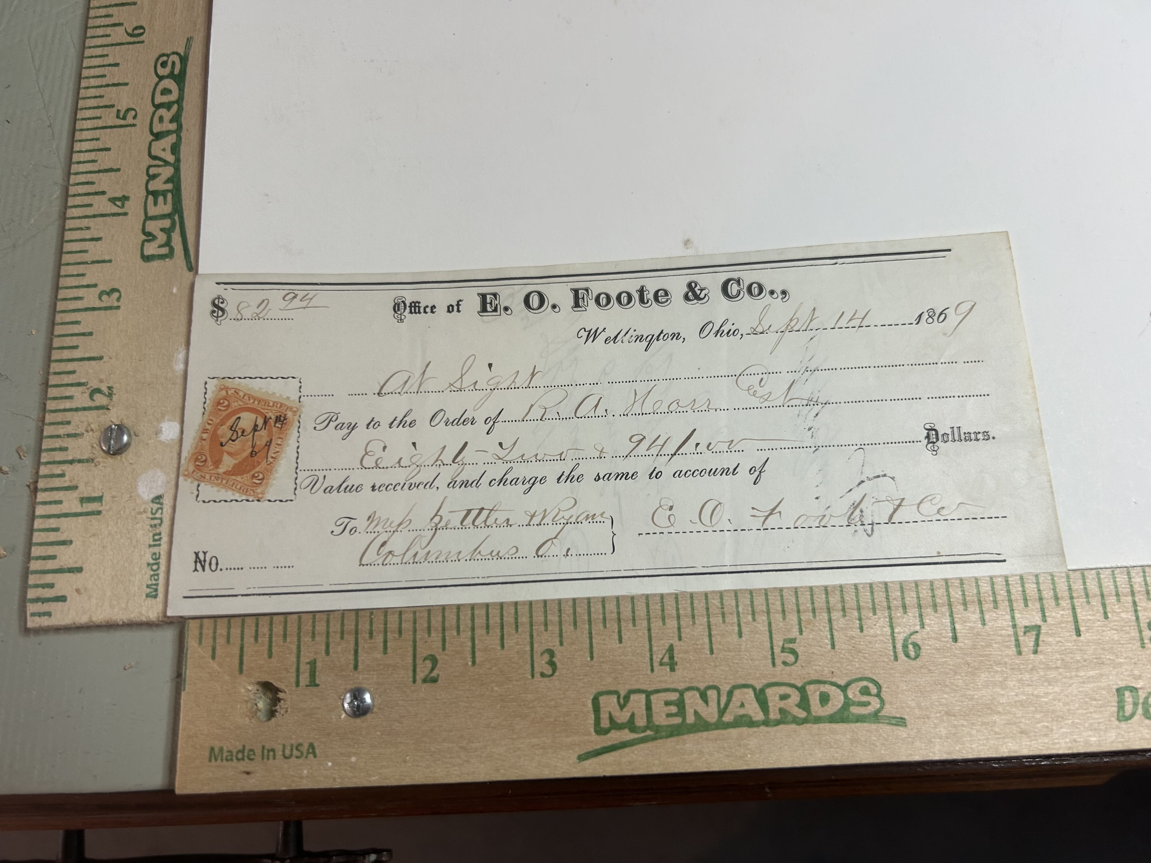 1869 Office of E.O.Foote &Co. Wellington Ohio hand stamped 2 cent revenue stamped check with multiple signatures on rear with normal folding practices of the period