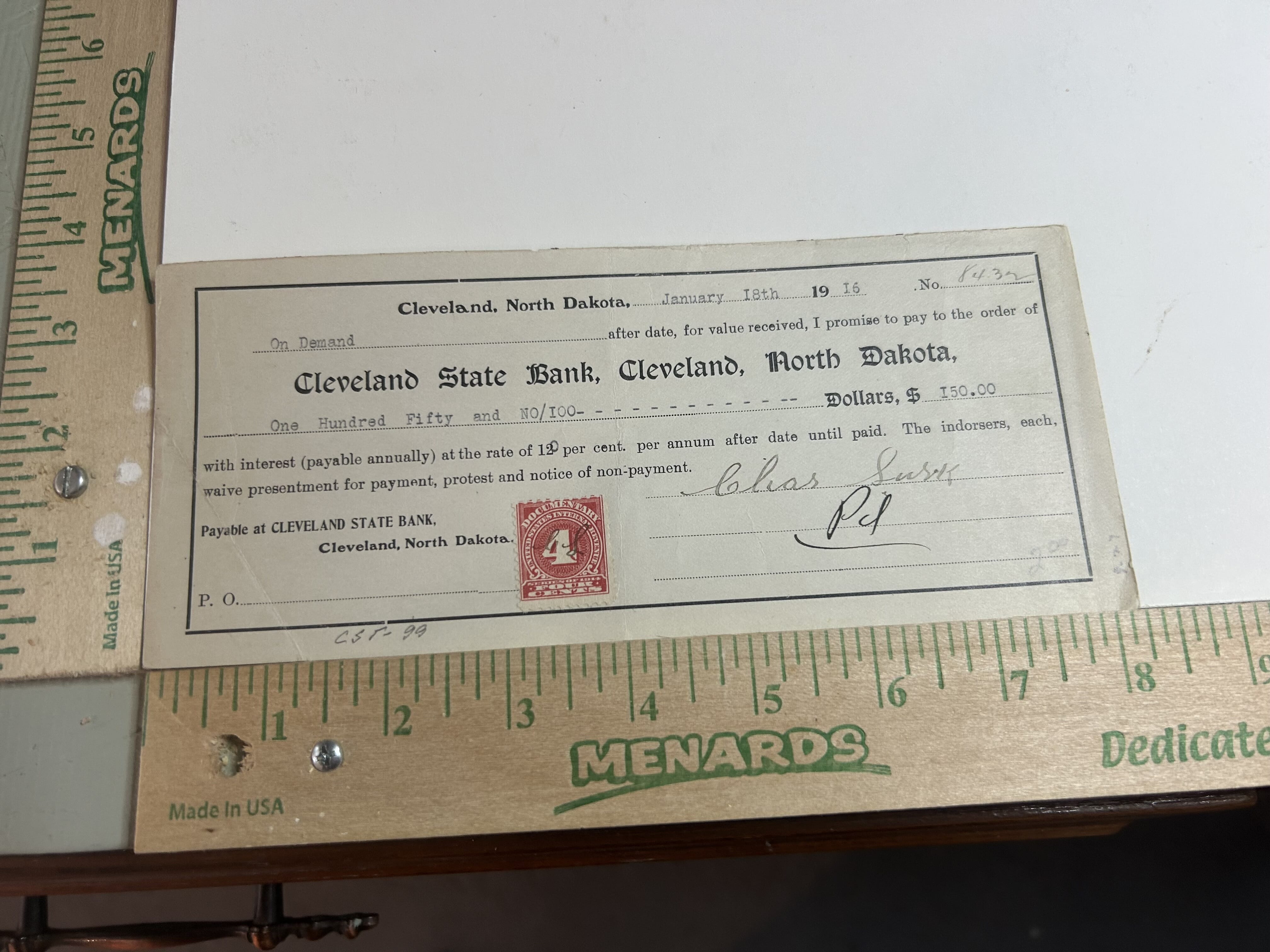 1916 Cleveland State Bank of Cleveland North Dakota hand canceled 4 cent revenue stamped check with normal folds and creases