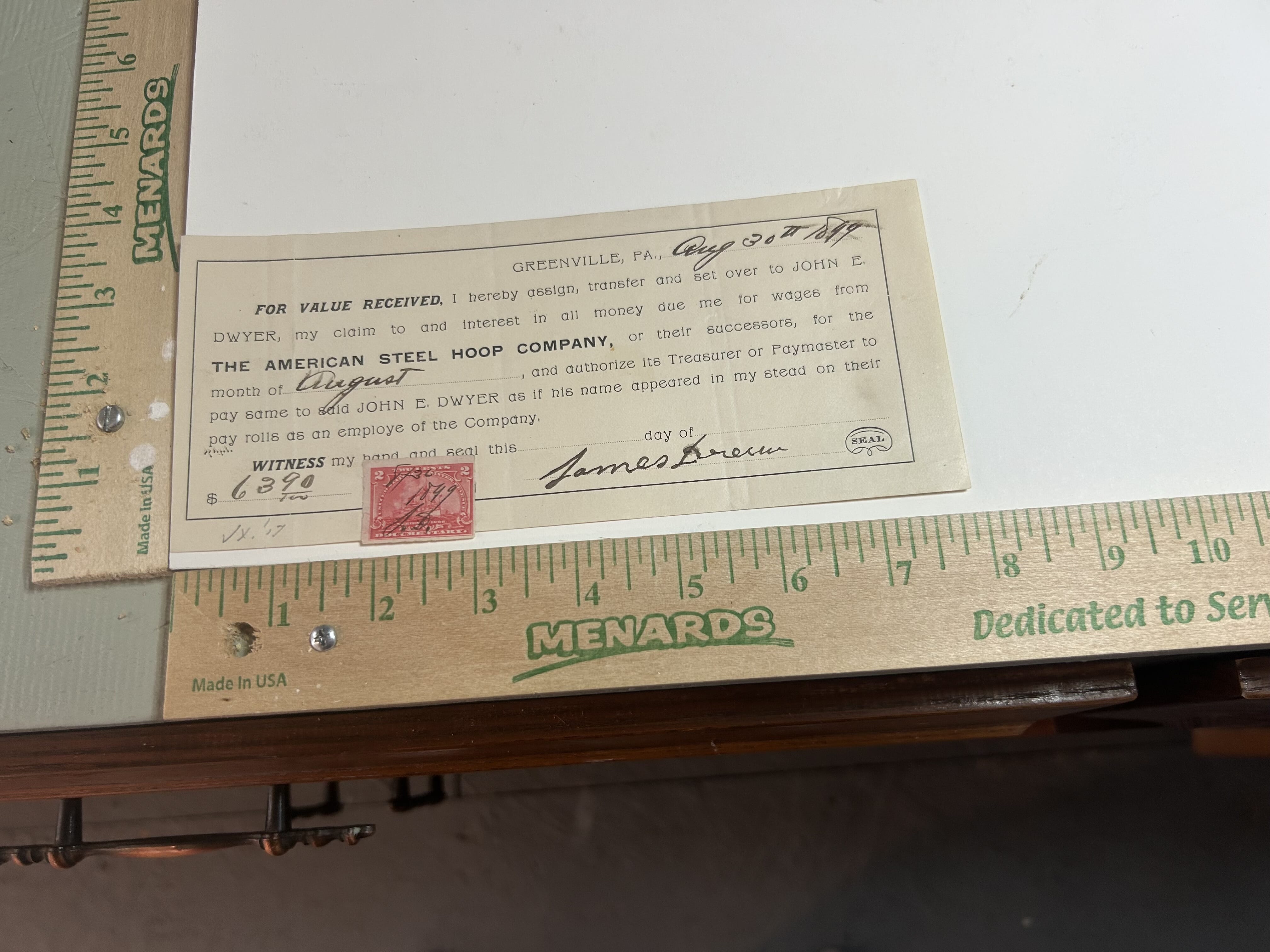 1899 American Steel Hoop Company hand cancelled revenue stamped transfer of wages agreement with normal folds of the period. Note that stamp hangs over edge of document